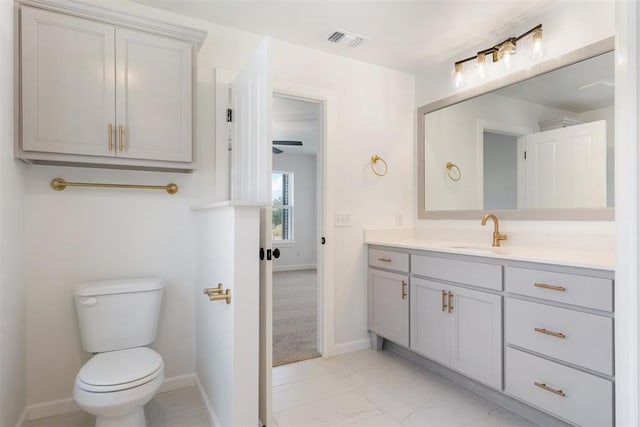 bathroom with vanity and toilet