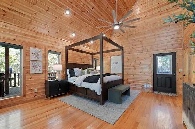 bedroom featuring light hardwood / wood-style floors, wooden ceiling, high vaulted ceiling, and multiple windows