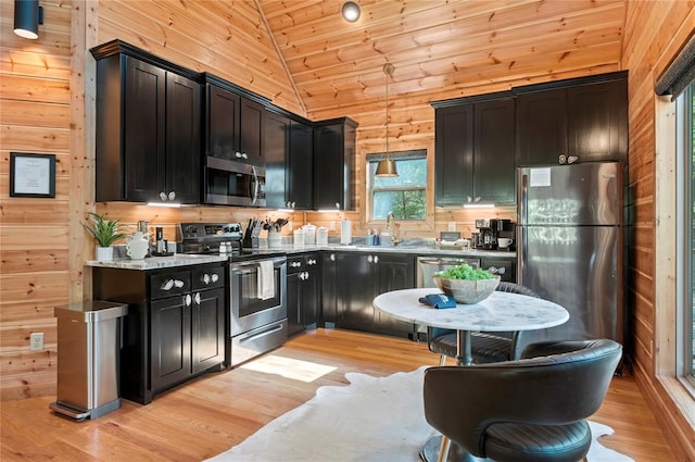 kitchen featuring stainless steel appliances, vaulted ceiling, wooden ceiling, and light hardwood / wood-style flooring