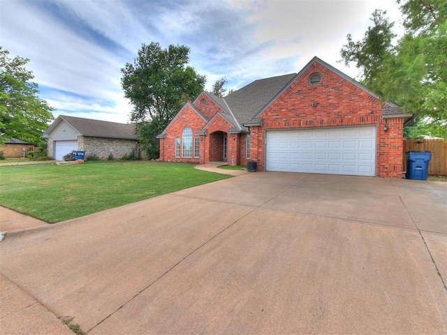 view of front of home featuring a garage and a front lawn