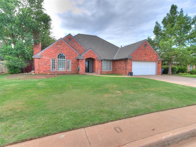 view of front of house featuring a garage and a front yard