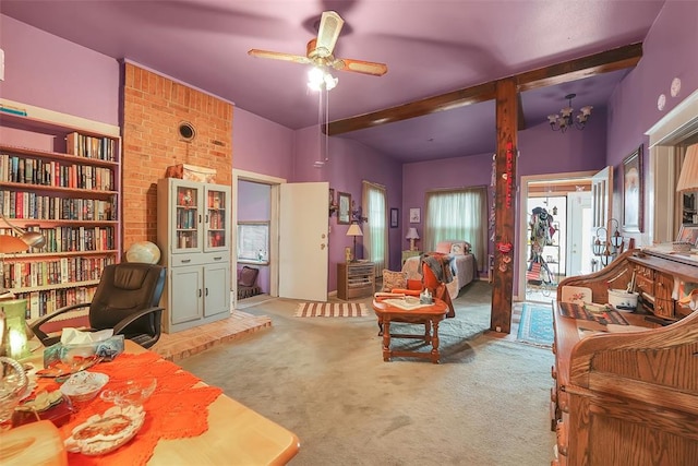 living room featuring beamed ceiling, ceiling fan with notable chandelier, and light carpet