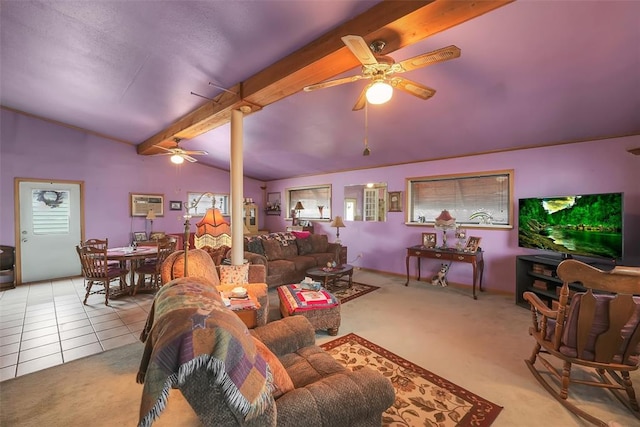 tiled living room with vaulted ceiling with beams, ceiling fan, and a healthy amount of sunlight