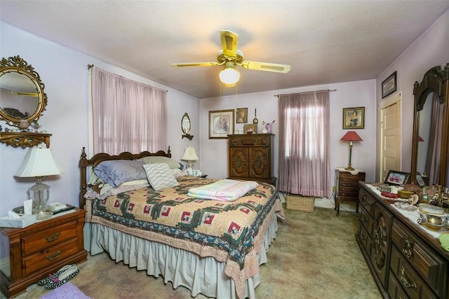 bedroom featuring ceiling fan and light carpet