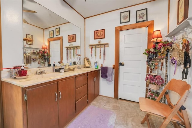 bathroom featuring vanity and crown molding