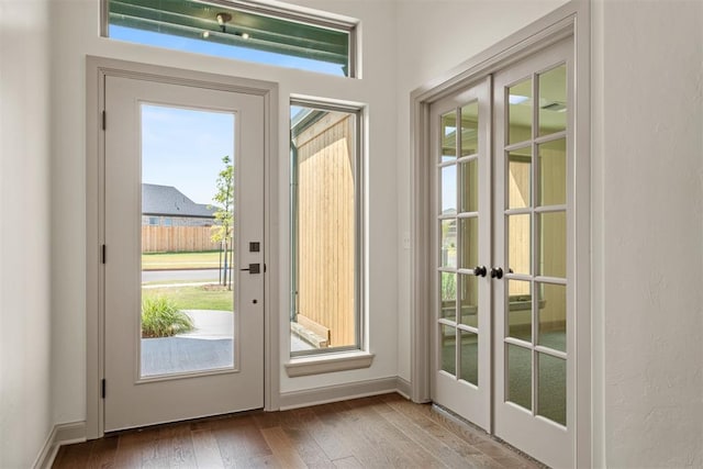 doorway to outside with french doors and hardwood / wood-style floors