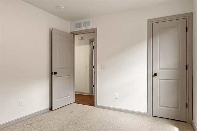 unfurnished bedroom with carpet