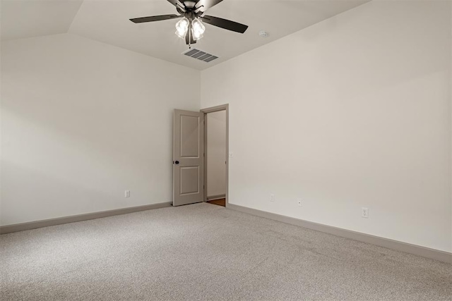 carpeted empty room featuring ceiling fan and vaulted ceiling