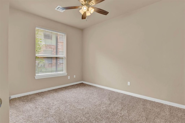 carpeted empty room featuring ceiling fan