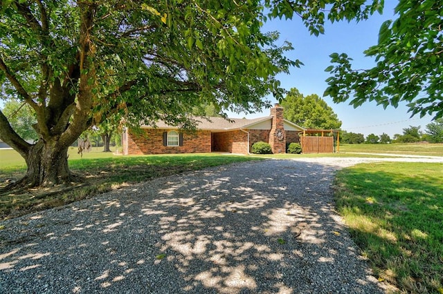 ranch-style house with a front yard