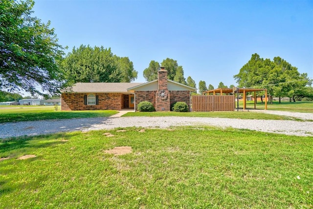 single story home featuring a front yard