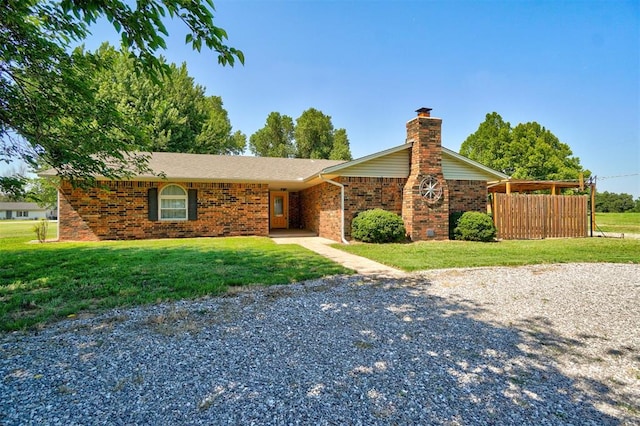 ranch-style house with a front lawn