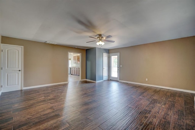 unfurnished room featuring ceiling fan and dark hardwood / wood-style flooring