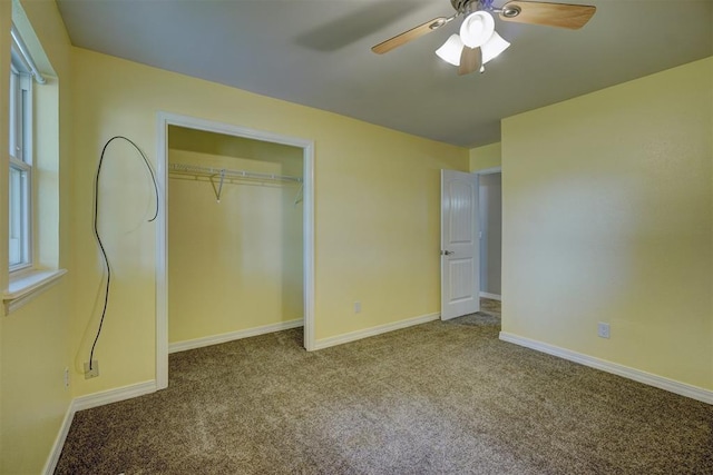 unfurnished bedroom featuring a closet, light colored carpet, and ceiling fan