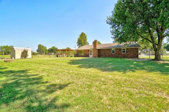 view of yard with a storage unit