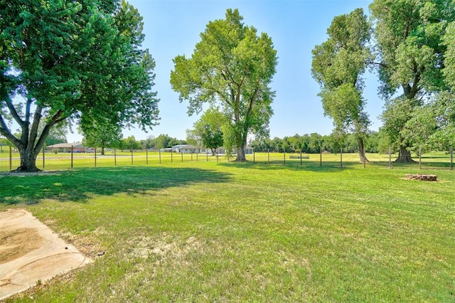 view of yard with a rural view