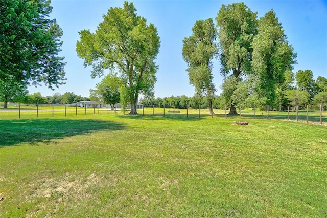 view of yard with a rural view