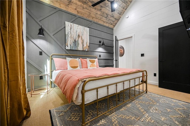 bedroom featuring carpet flooring, high vaulted ceiling, and ceiling fan