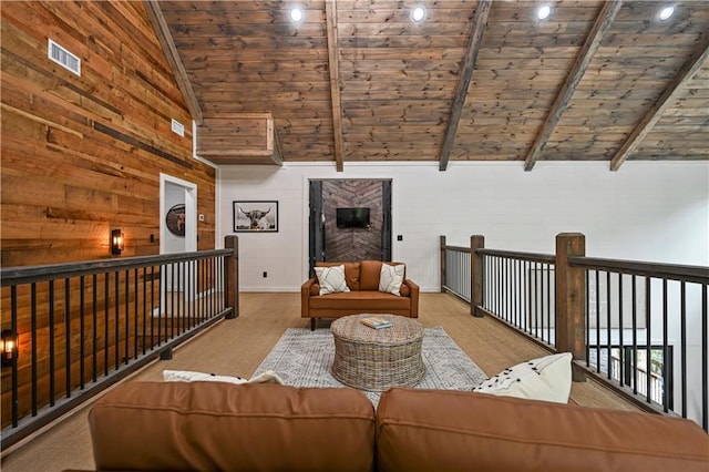 unfurnished room featuring beam ceiling, light wood-type flooring, wood ceiling, and high vaulted ceiling