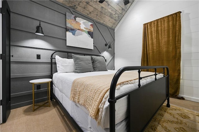 bedroom featuring carpet flooring, ceiling fan, wood ceiling, and lofted ceiling