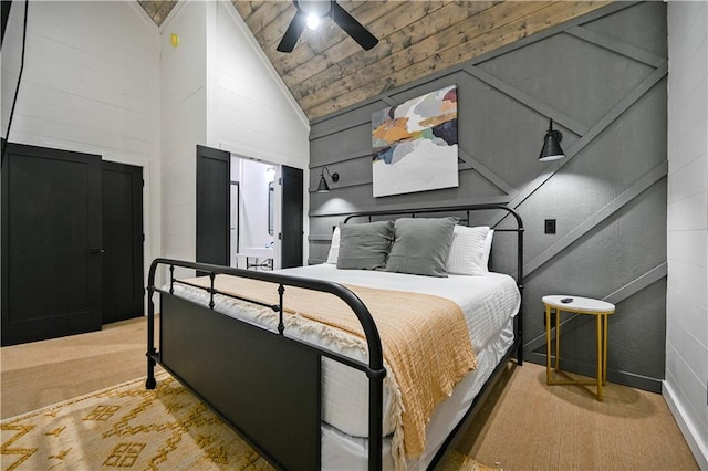 bedroom featuring light colored carpet, high vaulted ceiling, ceiling fan, and wooden ceiling