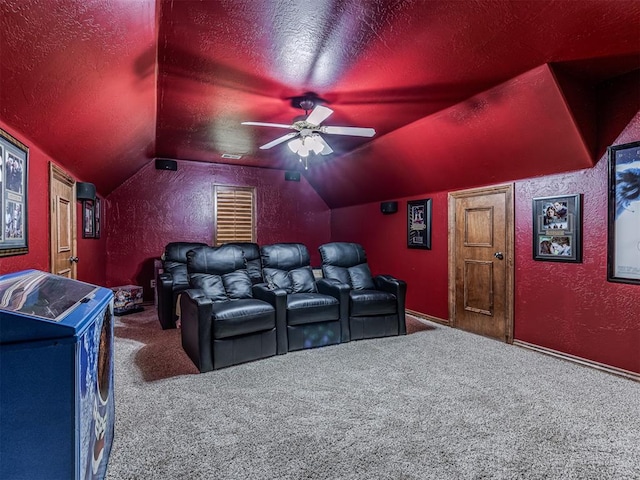 cinema featuring carpet flooring, ceiling fan, vaulted ceiling, and a textured ceiling