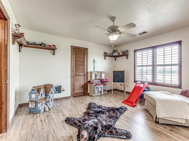 bedroom featuring ceiling fan and light hardwood / wood-style floors