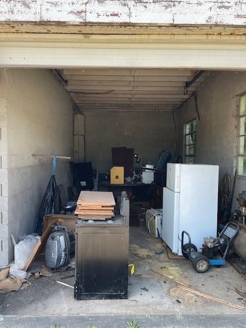 garage with white fridge