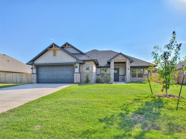 view of front of house with a garage and a front lawn