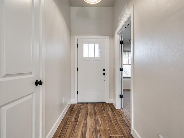 doorway with hardwood / wood-style floors