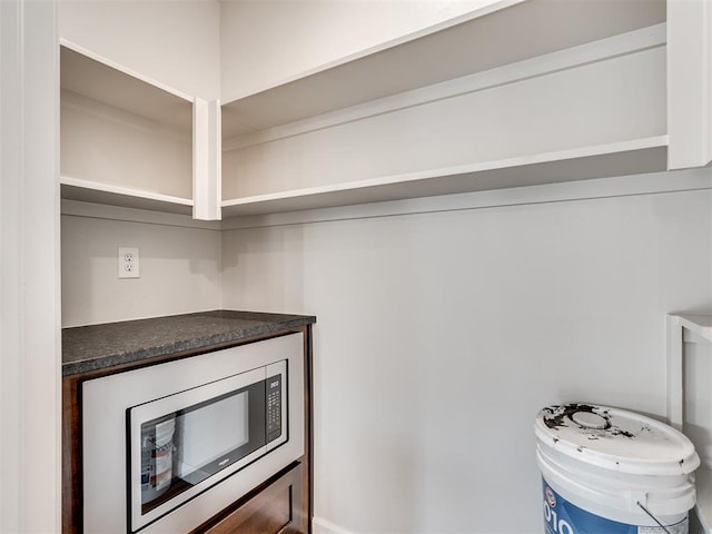 kitchen with stainless steel microwave