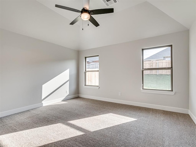 unfurnished room featuring ceiling fan, plenty of natural light, carpet floors, and lofted ceiling