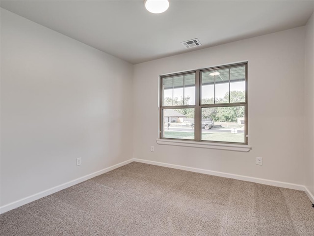 spare room featuring carpet flooring