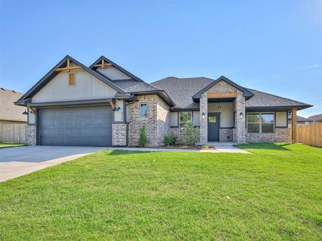 view of front of property with a garage and a front lawn