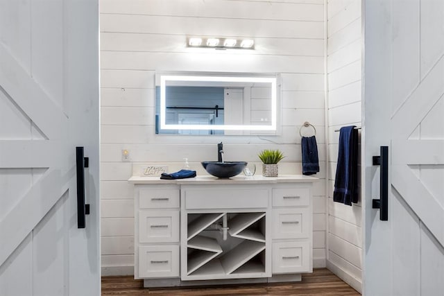 bathroom with vanity and hardwood / wood-style floors