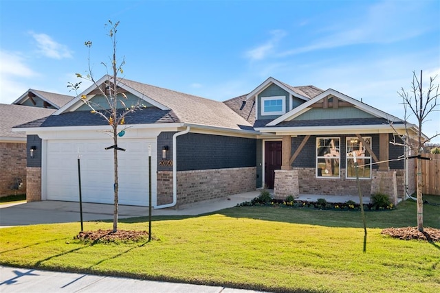 view of front of property with a front lawn and a garage