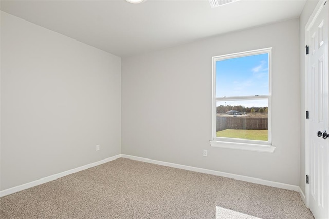 spare room featuring carpet