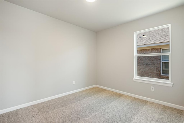 empty room featuring carpet flooring