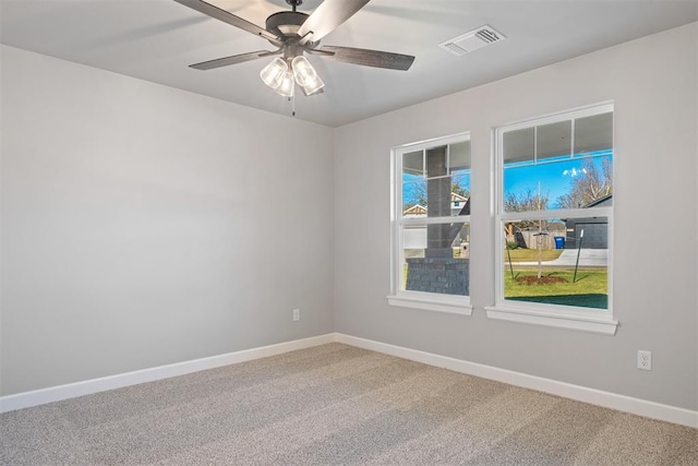 carpeted empty room with ceiling fan