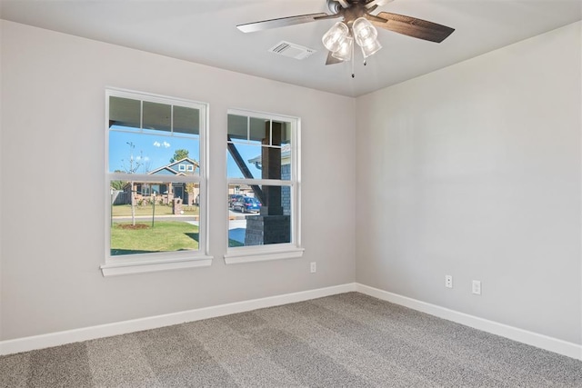 carpeted empty room featuring ceiling fan