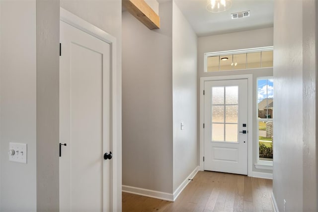 doorway with light hardwood / wood-style flooring