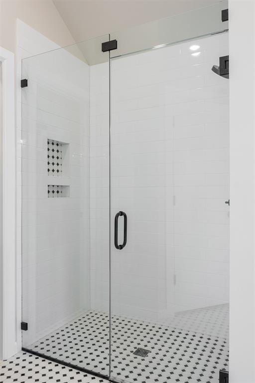 bathroom with a shower with shower door