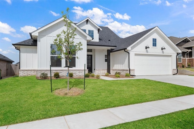 view of front of property featuring a garage and a front lawn