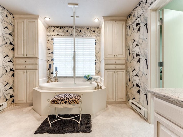 bathroom featuring vanity and a bath