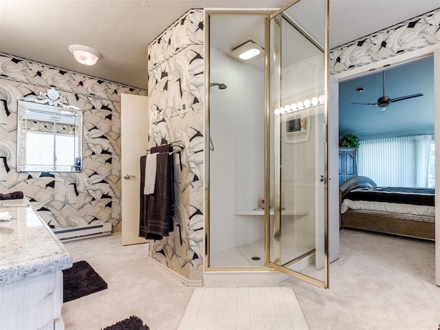 bathroom with walk in shower, vanity, baseboard heating, and ceiling fan