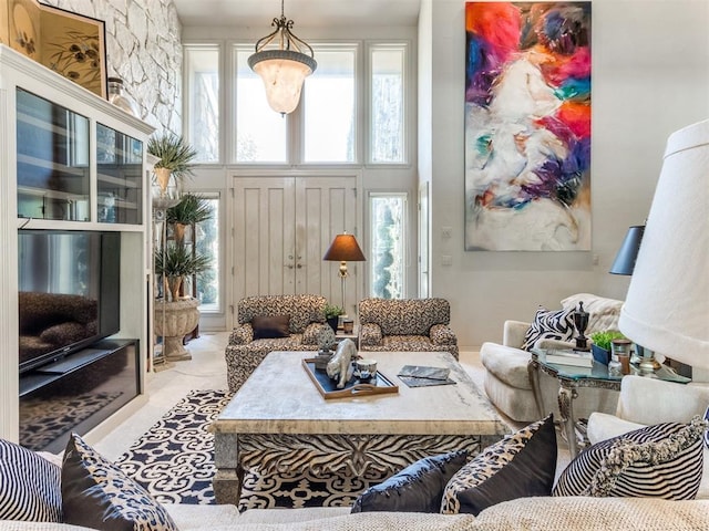 living room featuring a towering ceiling