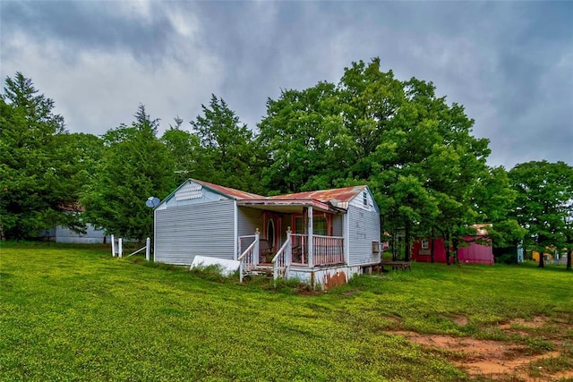 344586 E 860th Rd, Chandler, OK 74834 - view of front of house with a front yard and a porch