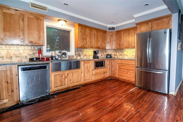 344586 E 860th Rd, Chandler, OK 74834 - kitchen featuring stainless steel appliances, dark wood-type flooring, a sink, light stone counters, and tasteful backsplash