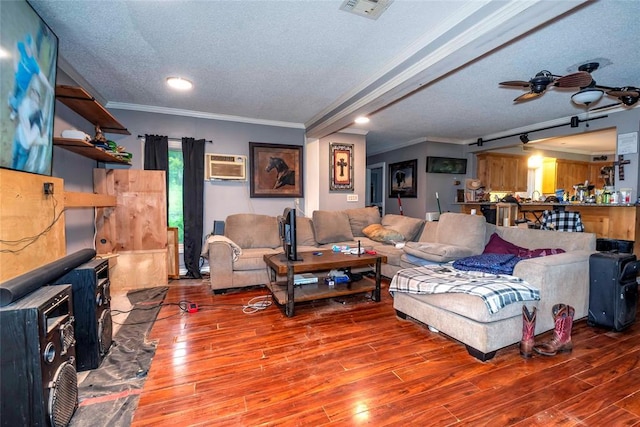 344586 E 860th Rd, Chandler, OK 74834 - living room featuring a wall mounted air conditioner, a textured ceiling, crown molding, wood finished floors, and recessed lighting