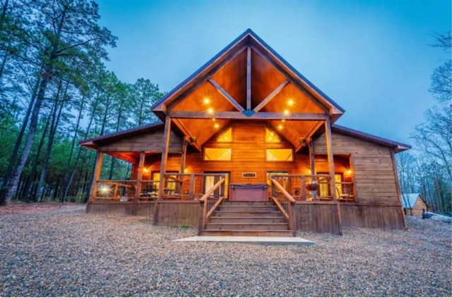 log cabin featuring a jacuzzi